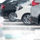 new vehicles on shiny car dealership flooring